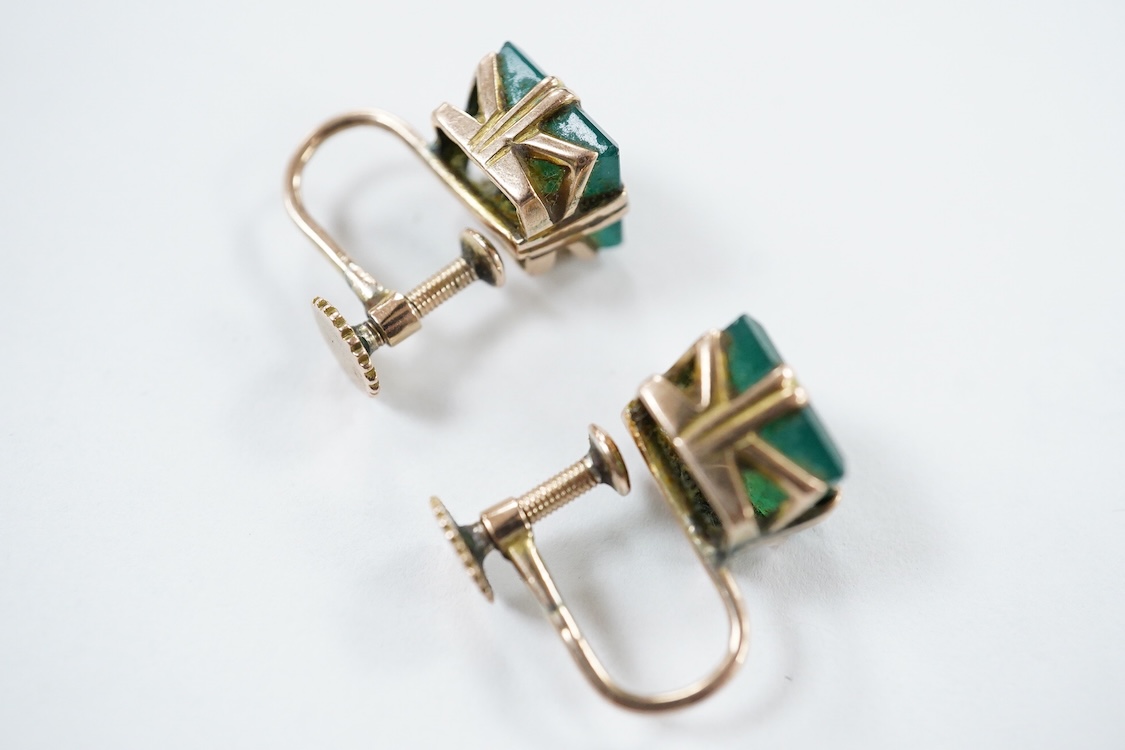 A yellow metal stick pin, the terminal modelled as a Knight's arm holding a scroll(a.f.), 79mm, together with two pairs of yellow metal and gem set ear clips including 9ct and opal doublet.